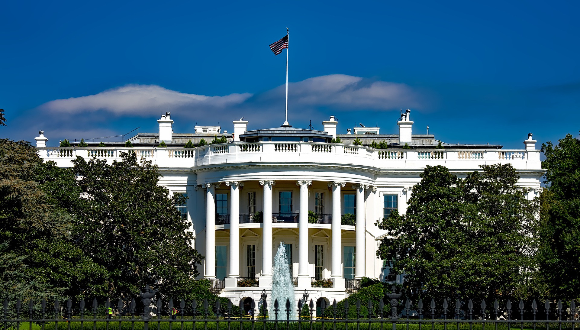 Photo of the front of The White House and lanscaping in front of The White House.